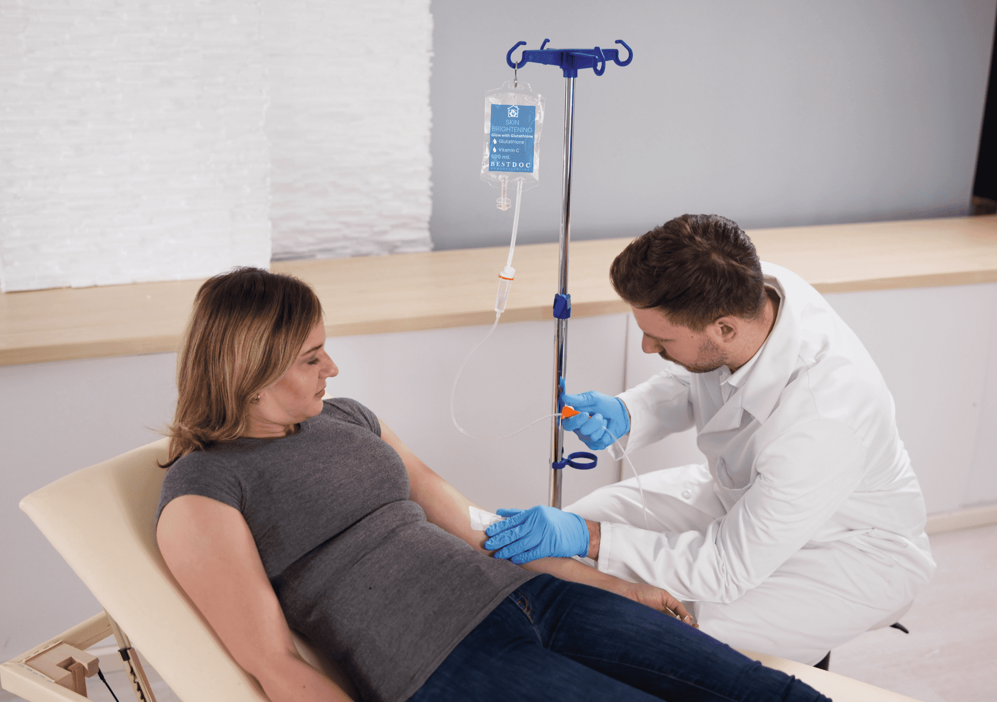 a Lady receiving IV Therapy from a Best DOC Doctor in her House