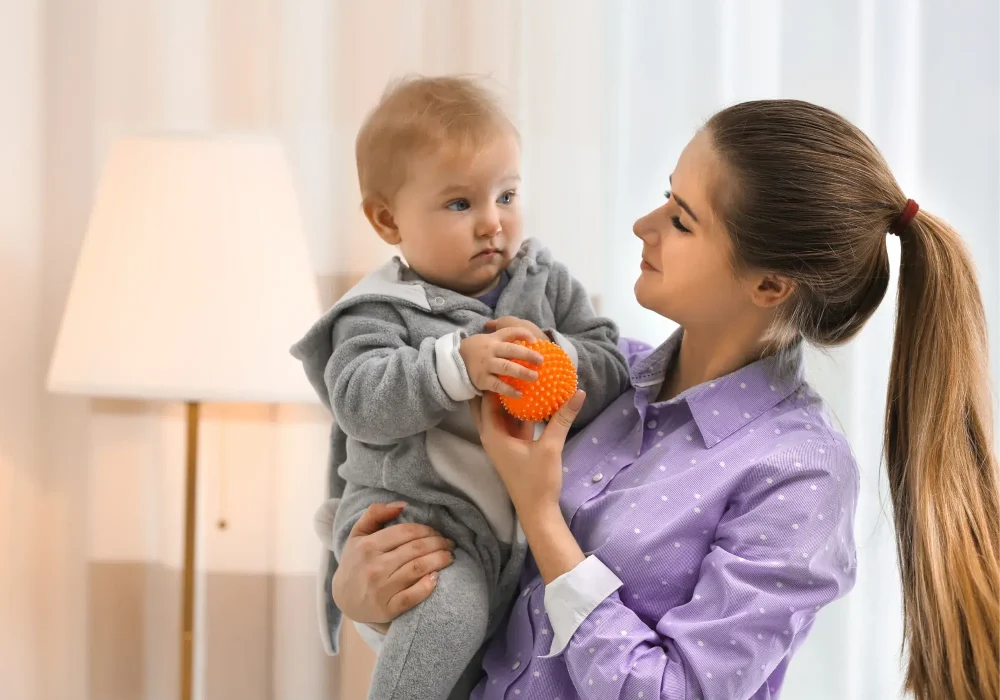 Nanny babysitting a baby